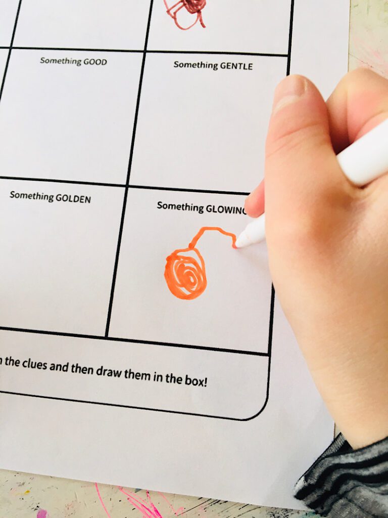 Close up of a child drawing on a scavenger hunt paper